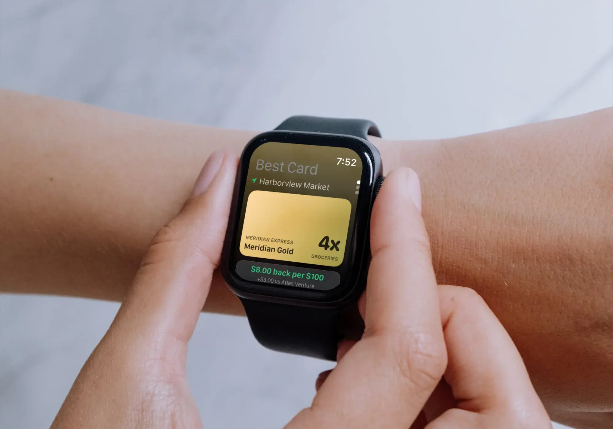A person checking CardSwipe on their Apple Watch, the screen naming the best card for the market they are standing in